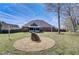 Spacious backyard featuring patio area and string lights, great for entertaining at 477 Glouchester Dr, Locust Grove, GA 30248