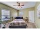 Simple bedroom with carpet, ceiling fan, and comfortable design at 477 Glouchester Dr, Locust Grove, GA 30248