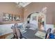 Charming dining room featuring a formal table setting, stylish decor, and warm lighting at 477 Glouchester Dr, Locust Grove, GA 30248
