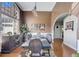 Elegant dining room with a large window, stylish chandelier, and formal dining set at 477 Glouchester Dr, Locust Grove, GA 30248