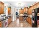 Functional kitchen with stainless steel appliances and warm, inviting design at 477 Glouchester Dr, Locust Grove, GA 30248