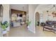 Cozy living room with a fireplace, plush seating, and arched doorway at 477 Glouchester Dr, Locust Grove, GA 30248
