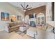Open-concept living area featuring a fireplace and views into the kitchen at 477 Glouchester Dr, Locust Grove, GA 30248