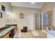 Bathroom features double sinks, granite counters, soaking tub and separate shower at 477 Glouchester Dr, Locust Grove, GA 30248