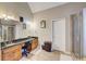 Bathroom features double sinks, granite counters, a soaking tub, and a separate shower at 477 Glouchester Dr, Locust Grove, GA 30248