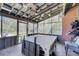 Spacious covered patio with concrete flooring and ceiling fans, perfect for outdoor dining and relaxation at 477 Glouchester Dr, Locust Grove, GA 30248