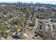 Aerial view of the neighborhood highlighting the house, landscape, and the skyline at 1857 Defoor Ave, Atlanta, GA 30318