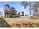 The backyard offers a large, level yard, a wooden fence, and a covered porch at 1857 Defoor Ave, Atlanta, GA 30318