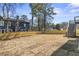 Newly sodded backyard with new wooden fence and access steps to upper porch at 1857 Defoor Ave, Atlanta, GA 30318