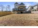 The spacious backyard features a wood fence, new grass, and a covered porch at 1857 Defoor Ave, Atlanta, GA 30318