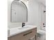 Contemporary bathroom with sleek vanity, large mirror, and modern fixtures at 1857 Defoor Ave, Atlanta, GA 30318