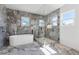 Stunning bathroom featuring a freestanding tub, glass shower, and elegant marble accents at 1857 Defoor Ave, Atlanta, GA 30318