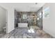 Elegant bathroom showcasing a standalone tub, glass shower, and luxurious marble tiling at 1857 Defoor Ave, Atlanta, GA 30318
