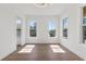 Bright, light filled bedroom with hardwood floors and two large windows at 1857 Defoor Ave, Atlanta, GA 30318