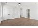 Spacious bedroom with hardwood floors, white trim, and multiple closets offering ample storage at 1857 Defoor Ave, Atlanta, GA 30318