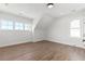 Bright bedroom with hardwood floors, multiple windows offering ample natural light, and a minimalist design at 1857 Defoor Ave, Atlanta, GA 30318
