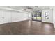Spacious garage featuring modern glass door, ceiling fan, and neutral color palette, offering versatile space at 1857 Defoor Ave, Atlanta, GA 30318