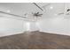 Large garage space with stained concrete flooring, ceiling fan, and recessed lighting at 1857 Defoor Ave, Atlanta, GA 30318
