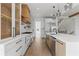 Stylish kitchen with stainless steel appliances, island, and hardwood floors at 1857 Defoor Ave, Atlanta, GA 30318