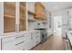 Contemporary kitchen with marble countertops, a stainless-steel oven, and wooden accents at 1857 Defoor Ave, Atlanta, GA 30318
