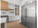 Bright kitchen with stainless steel appliances, marble countertops, and wooden accents at 1857 Defoor Ave, Atlanta, GA 30318