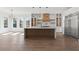 Bright, open kitchen with an island, stainless steel appliances, and hardwood floors at 1857 Defoor Ave, Atlanta, GA 30318