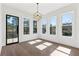 Bright living room featuring hardwood floors and multiple windows for ample natural light at 1857 Defoor Ave, Atlanta, GA 30318