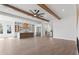 Open-concept living space with a fireplace and a view into the modern kitchen at 1857 Defoor Ave, Atlanta, GA 30318