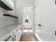 Walk-in pantry featuring marble countertops, shelves, and hardwood floors at 1857 Defoor Ave, Atlanta, GA 30318