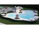 Community pool with zero entry, lounge chairs, umbrellas, and landscaping for relaxation and enjoyment at 229 Groveton Ct, Euharlee, GA 30145