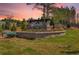Stone entrance sign for Heritage River community surrounded by landscaping and lush green grass at 229 Groveton Ct, Euharlee, GA 30145