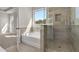 Beautiful bathroom featuring a separate shower, soaking tub, and ceramic tile at 229 Groveton Ct, Euharlee, GA 30145
