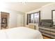Well-lit bedroom featuring hardwood floors, large windows with curtains, and simple yet stylish decor at 300 W Peachtree St # 10D, Atlanta, GA 30308