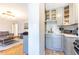 Well-lit kitchen featuring gray cabinets, a tiled backsplash, and stainless steel appliances at 300 W Peachtree St # 10D, Atlanta, GA 30308