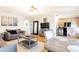 Cozy living room featuring a modern light fixture, hardwood floors, and comfortable seating area at 300 W Peachtree St # 10D, Atlanta, GA 30308