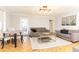 Inviting living room and dining area with hardwood floors, comfortable seating, and natural light at 300 W Peachtree St # 10D, Atlanta, GA 30308