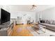 Spacious living room with hardwood floors, comfortable seating, and natural light from large windows at 300 W Peachtree St # 10D, Atlanta, GA 30308
