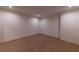 Finished basement with vinyl wood plank flooring and neutral colored walls at 581 Sherwood Ne Rd, Atlanta, GA 30324