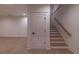 Finished basement featuring a door and a stairwell at 581 Sherwood Ne Rd, Atlanta, GA 30324