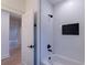 Bright bathroom features white subway tile, dark fixtures, and convenient shower niche at 581 Sherwood Ne Rd, Atlanta, GA 30324