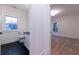 Bright bathroom next to a bedroom with black tile floors and a window at 581 Sherwood Ne Rd, Atlanta, GA 30324