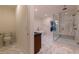 Bright bathroom featuring a glass shower, free standing tub, and decorative tile floor at 581 Sherwood Ne Rd, Atlanta, GA 30324