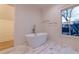 Elegant bathroom with soaking tub, window view, and modern fixtures creating a relaxing atmosphere at 581 Sherwood Ne Rd, Atlanta, GA 30324