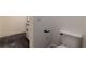 Bright bathroom showing toilet, vanity and tiled floors at 581 Sherwood Ne Rd, Atlanta, GA 30324