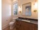 Bathroom featuring vanity with marble countertop and modern fixtures at 581 Sherwood Ne Rd, Atlanta, GA 30324