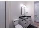 Modern bathroom with toilet, vanity, and tiled shower at 581 Sherwood Ne Rd, Atlanta, GA 30324