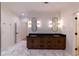 A spacious bathroom with double vanity, modern mirrors, and beautiful hexagon tile flooring at 581 Sherwood Ne Rd, Atlanta, GA 30324