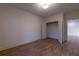 Bedroom showcasing hardwood floors, an open closet, and an open door to another room for added convenience at 581 Sherwood Ne Rd, Atlanta, GA 30324
