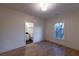 Inviting bedroom featuring hardwood floors and an ensuite bathroom with a view of the neighborhood at 581 Sherwood Ne Rd, Atlanta, GA 30324