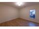 Inviting bedroom with hardwood floors, a bright window, and neutral walls at 581 Sherwood Ne Rd, Atlanta, GA 30324